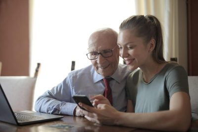 Young person talking with older person about Marketing Tips for Senior Entrepreneurs